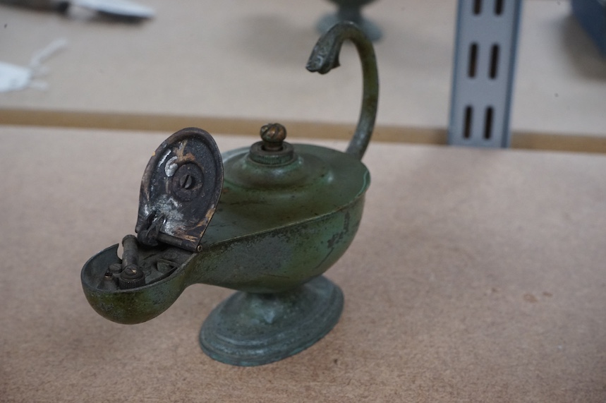 A vintage Dunhill patinated brass ‘oil lamp’ table lighter, 15cm long. Condition - worn, not tested